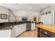 Open kitchen features granite countertops and white cabinets at 116 Dolly St, Punta Gorda, FL 33950