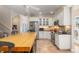 Large kitchen with butcher block island and stainless steel appliances at 116 Dolly St, Punta Gorda, FL 33950