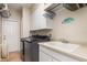 Convenient laundry room with washer, dryer, and ample storage at 116 Dolly St, Punta Gorda, FL 33950
