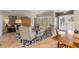 Bright living room featuring comfortable seating,tile floors, and access to a private balcony at 116 Dolly St, Punta Gorda, FL 33950