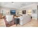Bright living room featuring a large TV and comfortable seating area at 116 Dolly St, Punta Gorda, FL 33950