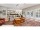 Open living room with views into the kitchen and access to a deck at 116 Dolly St, Punta Gorda, FL 33950