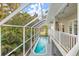 Elevated view of a private pool and relaxing screened balcony at 116 Dolly St, Punta Gorda, FL 33950