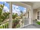 Covered porch overlooking the neighborhood and water at 116 Dolly St, Punta Gorda, FL 33950