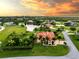 Stunning aerial view of waterfront home with tropical landscaping at 24087 Santa Inez Rd, Punta Gorda, FL 33955