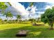 Large backyard with grassy area and games at 24087 Santa Inez Rd, Punta Gorda, FL 33955