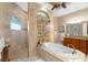 Spa-like bathroom featuring a soaking tub and walk-in shower at 24087 Santa Inez Rd, Punta Gorda, FL 33955