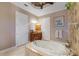Relaxing bathroom featuring a jetted tub and neutral tones at 24087 Santa Inez Rd, Punta Gorda, FL 33955