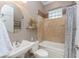 Simple bathroom with a tub shower combo and updated vanity at 24087 Santa Inez Rd, Punta Gorda, FL 33955