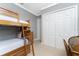 Bright bedroom with a bunk bed and ample closet space at 24087 Santa Inez Rd, Punta Gorda, FL 33955