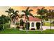 Luxury home with terracotta roof and palm trees at 24087 Santa Inez Rd, Punta Gorda, FL 33955