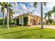Single-Gathering home with palm trees and a manicured lawn at 24087 Santa Inez Rd, Punta Gorda, FL 33955