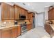 Modern kitchen with stainless steel appliances and granite countertops at 24087 Santa Inez Rd, Punta Gorda, FL 33955