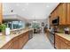 Eat-in kitchen with granite countertops, stainless steel appliances, and view to backyard at 24087 Santa Inez Rd, Punta Gorda, FL 33955