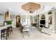 Spacious living room with high ceilings, fireplace and large windows at 24087 Santa Inez Rd, Punta Gorda, FL 33955
