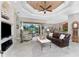 Bright living room with leather sofa and built-ins at 24087 Santa Inez Rd, Punta Gorda, FL 33955