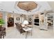 Open living area with built-ins and coffered ceiling at 24087 Santa Inez Rd, Punta Gorda, FL 33955