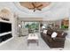 Bright living room with leather sofa and built-ins at 24087 Santa Inez Rd, Punta Gorda, FL 33955