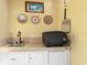 Outdoor kitchen with grill, sink, and mini-fridge at 24087 Santa Inez Rd, Punta Gorda, FL 33955