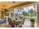 Spacious covered patio with outdoor dining and pool views at 24087 Santa Inez Rd, Punta Gorda, FL 33955