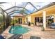 Relaxing screened pool and patio with outdoor dining furniture at 24087 Santa Inez Rd, Punta Gorda, FL 33955