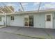 View of home's exterior and screened patio at 2931 S Cranberry Blvd, North Port, FL 34286