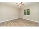 Well-lit bedroom with wood-look floors at 2931 S Cranberry Blvd, North Port, FL 34286