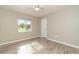 Bright bedroom featuring wood-look floors at 2931 S Cranberry Blvd, North Port, FL 34286