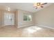 Bright living room with tile floors and a ceiling fan at 2931 S Cranberry Blvd, North Port, FL 34286