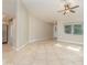 Open concept living room with tile floors and access to front entry at 2931 S Cranberry Blvd, North Port, FL 34286