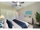 Spacious bedroom with ceiling fan and large closet at 4767 Maurbach Ter, North Port, FL 34286