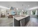 Bright, airy kitchen with granite island overlooking living room at 4767 Maurbach Ter, North Port, FL 34286