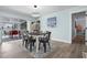 Chic dining area featuring modern lighting fixture and sliders to pool at 635 Erroll St, Port Charlotte, FL 33952