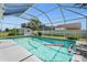 Sparkling screened-in pool with floats at 635 Erroll St, Port Charlotte, FL 33952