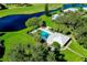 Aerial view of community pool, clubhouse, and golf course at 1515 Forrest Nelson Blvd # G102, Port Charlotte, FL 33952