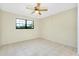 Bedroom with tile floor, neutral walls, and ceiling fan at 1515 Forrest Nelson Blvd # G102, Port Charlotte, FL 33952