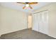 Bedroom with neutral walls, carpet, and a large closet at 1515 Forrest Nelson Blvd # G102, Port Charlotte, FL 33952