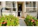 Building entrance with stairs and lush tropical landscaping at 1515 Forrest Nelson Blvd # G102, Port Charlotte, FL 33952