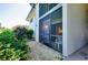 Exterior view of building with landscaping and patio at 1515 Forrest Nelson Blvd # G102, Port Charlotte, FL 33952