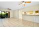 Bright living room with tile floors and sliding glass doors to a patio at 1515 Forrest Nelson Blvd # G102, Port Charlotte, FL 33952