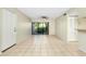 Living room with tile floors, sliding glass doors, and ceiling fan at 1515 Forrest Nelson Blvd # G102, Port Charlotte, FL 33952