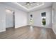 Bright bedroom with wood-look floors and double-door closet at 3712 Carmichael Dr, Punta Gorda, FL 33950