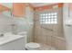 Bathroom with shower, toilet and grab bars at 1507 Lavilla Rd, Punta Gorda, FL 33950
