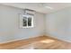 Simple bedroom with hardwood floors and a window at 1507 Lavilla Rd, Punta Gorda, FL 33950