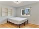 Cozy bedroom with hardwood floors, built-in shelves, and a window at 1507 Lavilla Rd, Punta Gorda, FL 33950
