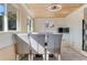 Bright dining area with wood ceiling, tile floor, and a table with four chairs at 1507 Lavilla Rd, Punta Gorda, FL 33950