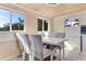 Bright dining area with wood-look floors and marble table at 1507 Lavilla Rd, Punta Gorda, FL 33950