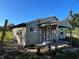 Fixer-upper home with rustic siding and porch at 1507 Lavilla Rd, Punta Gorda, FL 33950