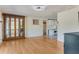 Living room with hardwood floors and view to kitchen at 1507 Lavilla Rd, Punta Gorda, FL 33950