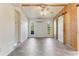 Spacious living room featuring wood accent wall and tile flooring at 1507 Lavilla Rd, Punta Gorda, FL 33950